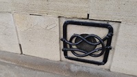 public art on Dock street building resembling a knot